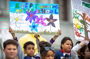 Kids holding signs at 2024 Afterschool Advocacy Day. 