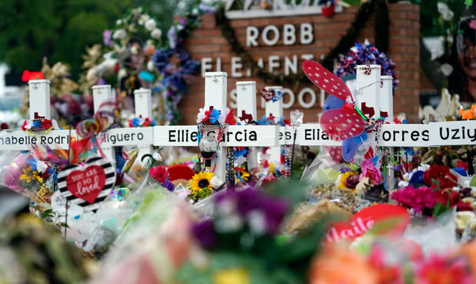 Image shows a memorial outside of Robb Elementary School.