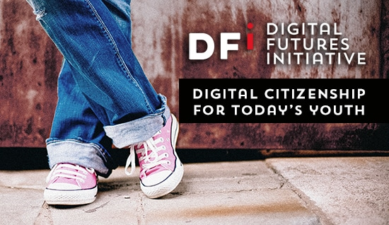 Picture of someone's lower legs with their feet crossed wearing sneakers with the DFI logo.